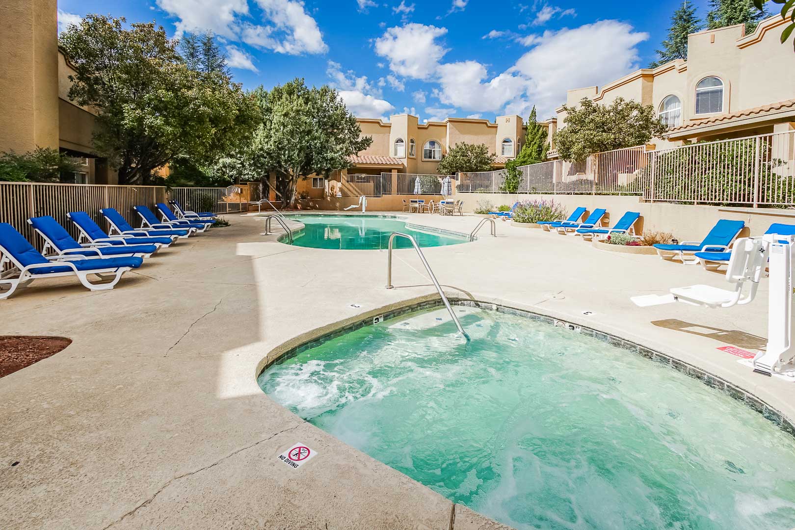 A beautiful outdoor swimming pool and jacuzzi at VRI's Sedona Springs Resort in Sedona, Arizona.